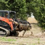 Kubota SVL75 With Quick Claw Rake 4