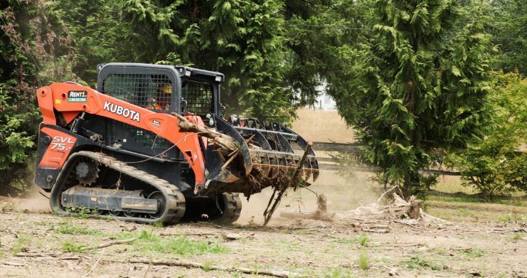 Kubota SVL75 With Quick Claw Rake